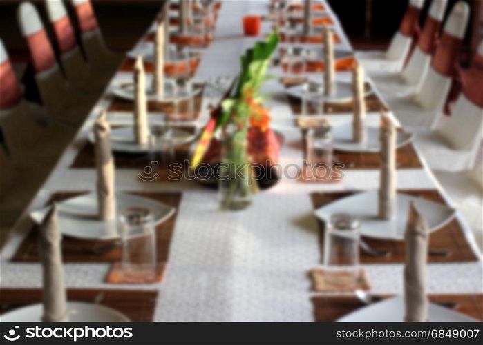 blurry photo of restaurant dinner table setting
