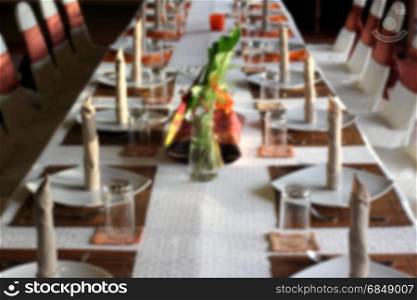blurry photo of restaurant dinner table setting