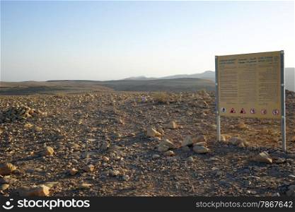 Board near entrance to Judean desert national park, Israel