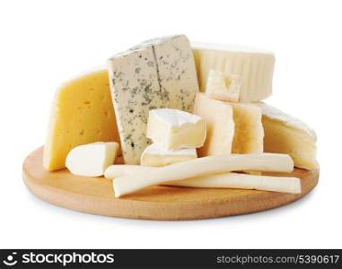 Board with pieces of various types of cheese on the board
