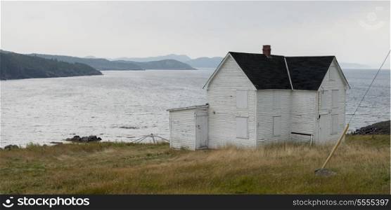 Boarded up House at the coast, Keels, Bonavista Peninsula, Newfoundland And Labrador, Canada