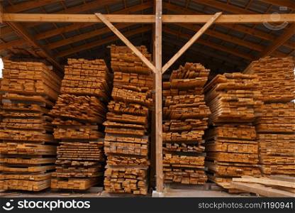 Boards on timber warehouse outdoor, nobody, lumber industry, carpentry. Wood processing on factory, forest sawing in lumberyard, sawmill