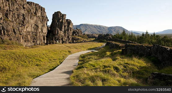 Boardwalk hiking trail through rugged canyon