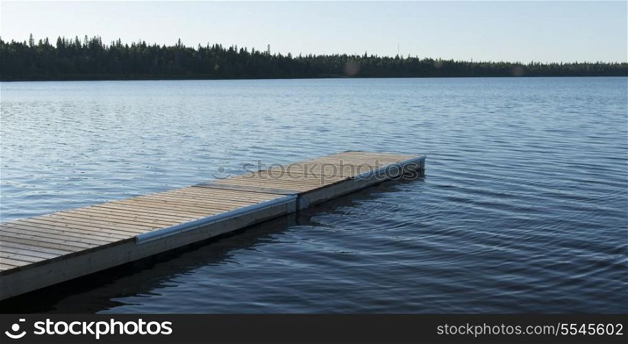 Boardwalk in a lake, Wasagaming, Riding Mountain National Park, Manitoba, Canada