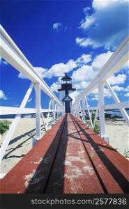 Boardwalk leading to a lighthouse, Cape Cod, Massachusetts, USA