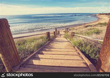 Boardwalk on the beach. Wooden boardwalk on the tropical beach in Costa Rica, Central America