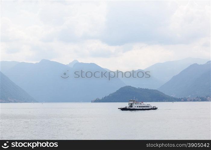 Boat against mountains on Lake Como in Italy