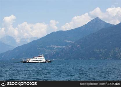 Boat against mountains on Lake Como in Italy