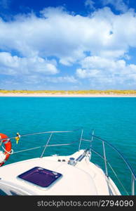 Boat anchored in Formentera Espalmador in turquoise Balearic island