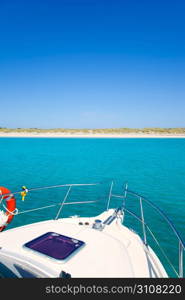 Boat anchored in Formentera Espalmador in turquoise Balearic island