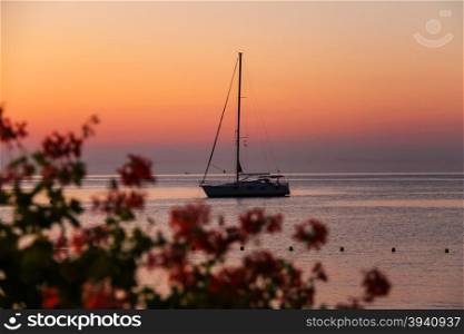 Boat anchored in the small port on Elba Island, Italy on the sunset