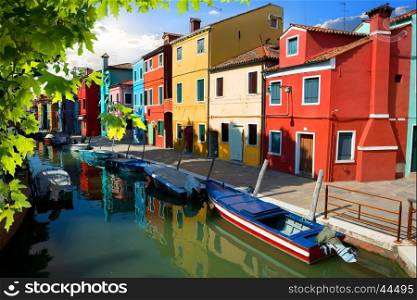 Boat and colored houses in Venetian Burano, Italy