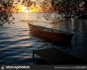 Boat at the pier at the sunset, Pleshcheyevo lake, Russia