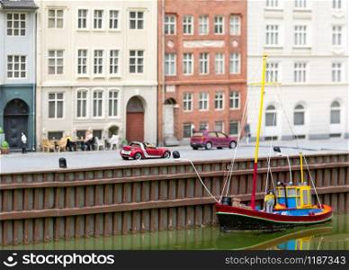 Boat, cars and summer street cafe, miniature scene outdoor, europe. Mini figures with high detaling of objects, realistically diorama