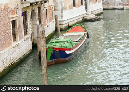 Boat docked in a canal, Grand Canal, Venice, Italy