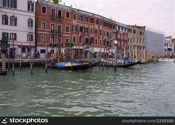 Boat docked in a canal in front of buildings, Grand Canal, Venice, Italy
