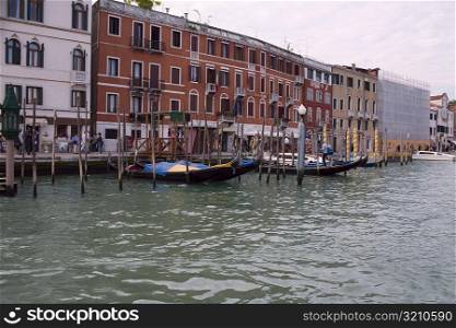 Boat docked in a canal in front of buildings, Grand Canal, Venice, Italy