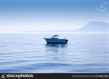 boat fishing in Mediterranean Denia sea with Mongo mountain