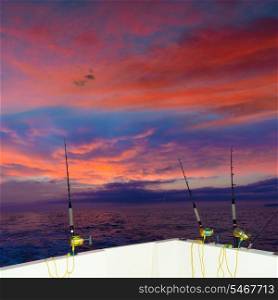 boat fishing trolling at sunset big game with rods and reels in saltwater