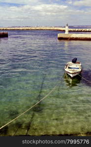 Boat in a Quiet Harbor on the Atlantic Coast of Portugal, Vintage Style Toned Picture