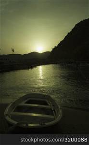 Boat in a river at sunset, Italian Riviera, Cinque Terre National Park, Il Porticciolo, Vernazza, La Spezia, Liguria, Italy