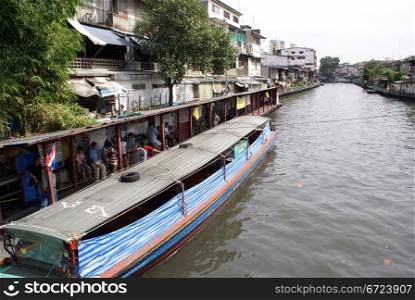 Boat in channel in Bangkok, Thailand