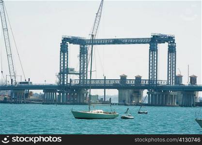 Boat in front of a bridge, Bridge Of Lions, Matanzas Bay, St Augustine, Florida, USA