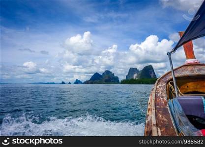 Boat in Phang Nga Bay and limestone cliffs, Thailand. boat in Phang Nga Bay, Thailand