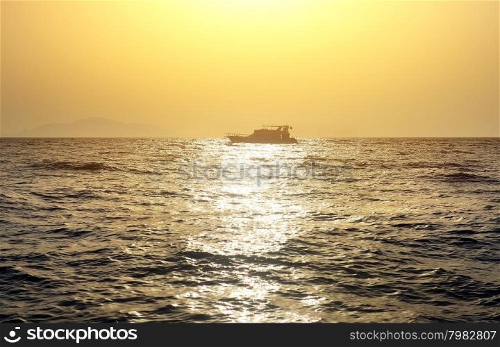 Boat in red sea at the sunset