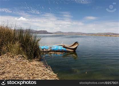 boat in the Uro Islands,Peru. Traditional reed boat (totora) in the Uros Islands, Titicaca Lake or Titikaka Lake, Peru, South America