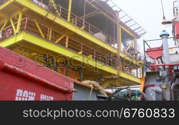 Boat moving to offshore gas production platform