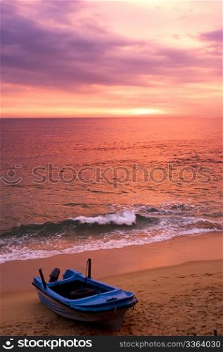 Boat on the beach at sunset. Sri Lanka