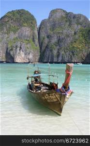 Boat on the beach near rock, Ko Phi Phi island, Thailand