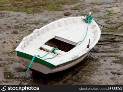 Boat on the wet sand at low tide