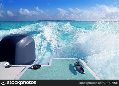 boat outboard stern with prop wash foam caribbean sea