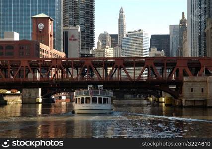 Boat passing under a bridge
