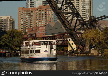 Boat passing under a bridge