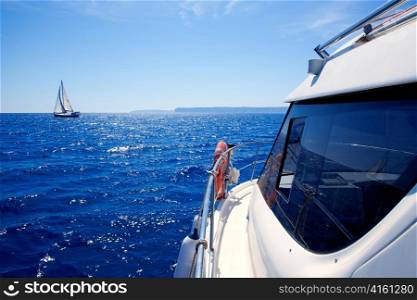 boat side view of blue ocean with sailboat in Mediterranean sea