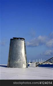 Boat stainless steel oval chimney over blue sunny sky