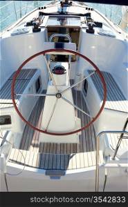 boat stern with big steering wheel and sailboat stern deck
