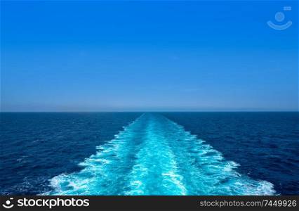 Boat wake ferry cruise wash foam in blue ocean sea