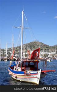 Boat with turkish red flag in Bodrum, Turkey