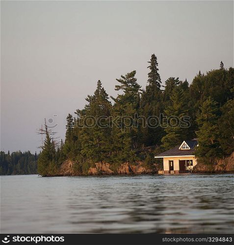 Boathouse at shoreline in Lake of the Woods, Ontario