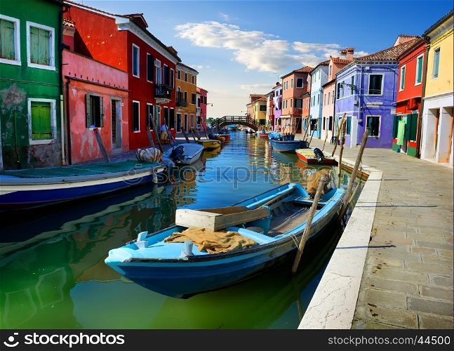 Boats and colored houses in summer Burano, Italy