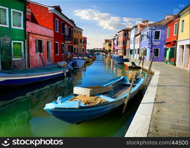 Boats and colored houses in summer Burano, Italy