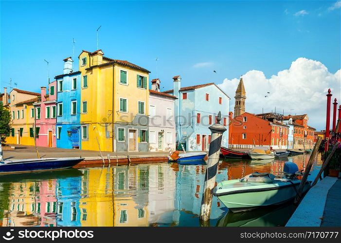 Boats and colored houses in summer Burano, Italy. Boats and colored houses