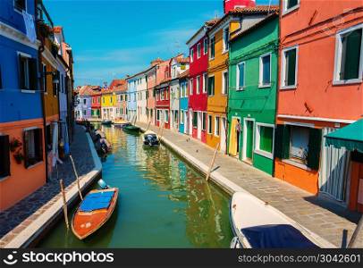 Boats and colored houses in summer Burano, Italy. Houses in summer Burano
