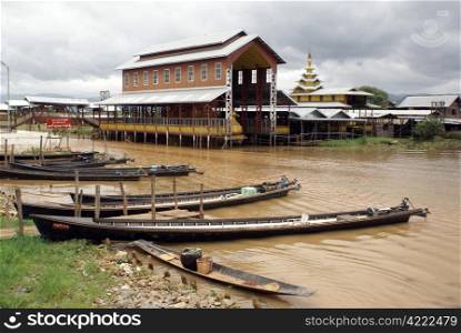 Boats and monastery on the Inle lake, Shan State, Myanmar