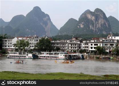 Boats and rafts for tourists on the river in Yanshuo, China