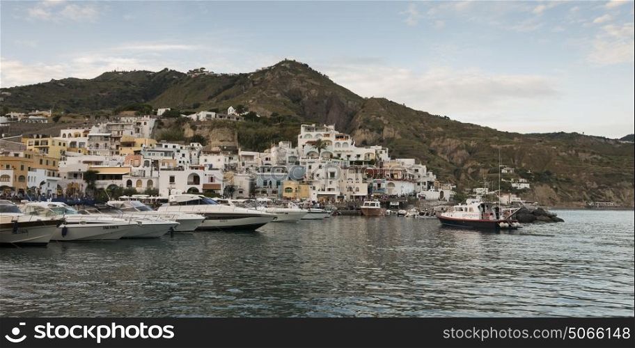 Boats at dock by coastal town, Sant'Angelo, Ischia Island, Campania, Italy